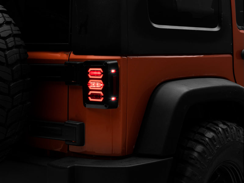 Raxiom 07-18 Jeep Wrangler JK LED Tail Lights- Black Housing (Smoked Lens) J106751 J106751 Photo - Primary