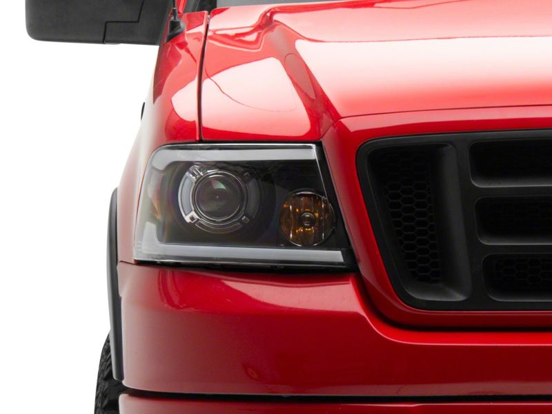 Raxiom 04-08 Ford F-150 Axial Series Projector Headlights w/ SEQL LED Bar- Blk Housing (Clear Lens) T566364 T566364 Photo - Close Up
