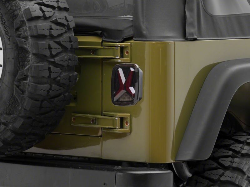 Raxiom 76-06 Jeep CJ7 Wrangler YJ & TJ Gladiator LED Tail Lights- Blk Housing (Smoked Lens) J177410 J177410 Photo - Close Up