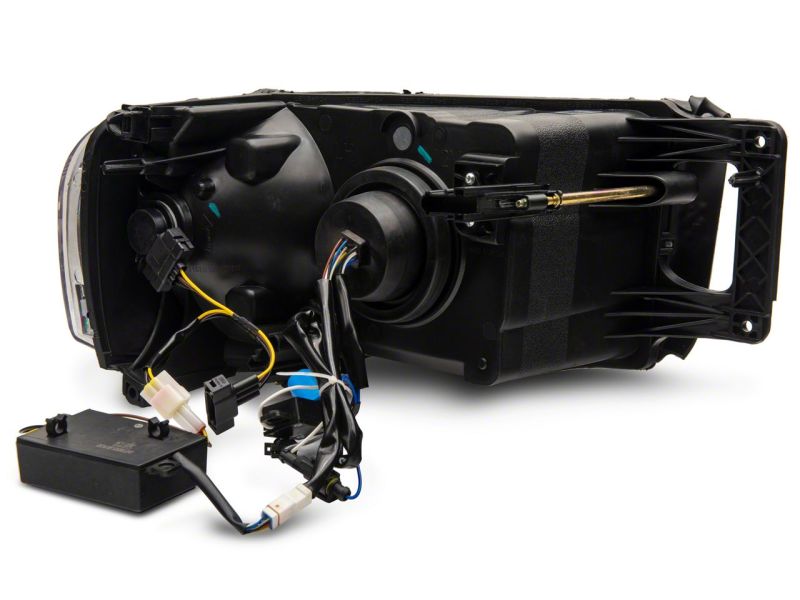 Raxiom 02-05 Dodge RAM 1500 LED Projector Headlights w/ SEQL LED Bar- Blk Housing (Clear Lens) R131478 R131478 Photo - Close Up