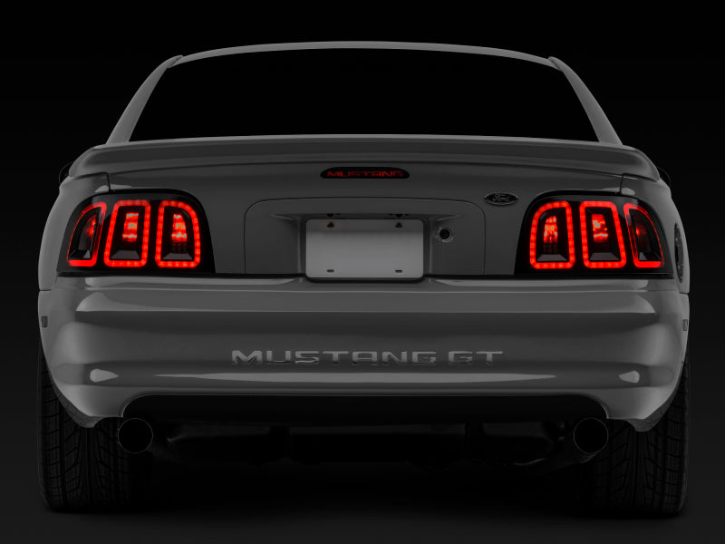 Raxiom 96-98 Ford Mustang Icon LED Tail Lights- Black Housing (Smoked Lens) 389876 389876 Photo - Close Up