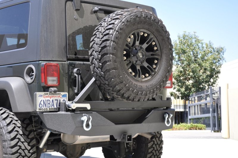 DV8 Offroad 07-18 Jeep Wrangler JK Rear Bumper w/ Tire Carrier & Tapered Bearing RBSTTB-01BR RBSTTB-01BR Photo - lifestyle view