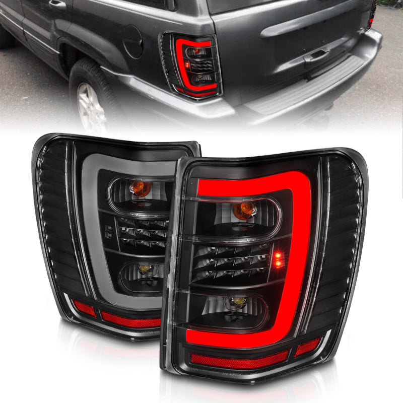 ANZO 1999-2004 Jeep Grand Cherokee LED Tail Lights w/ Light Bar Black Housing Clear Lens 311394 311394 Photo - Primary