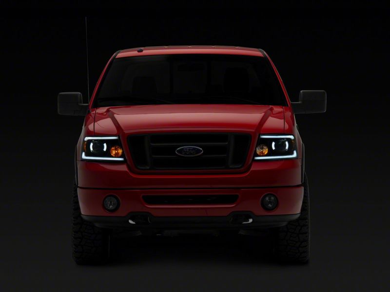 Raxiom 04-08 Ford F-150 Axial Series Projector Headlights w/ SEQL LED Bar- Blk Housing (Clear Lens) T566364 T566364 Photo - Close Up