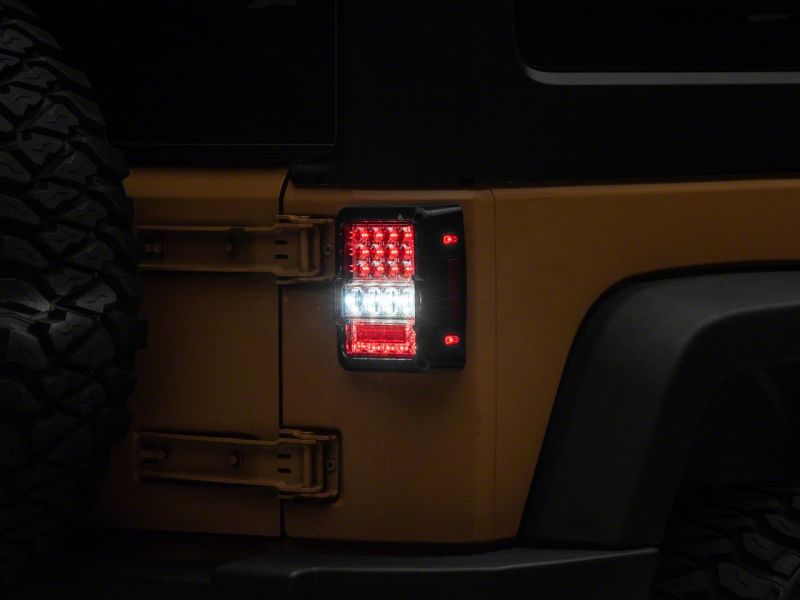 Raxiom 07-18 Jeep Wrangler JK Axial Series Lux LED Tail Lights- Blk Housing (Clear Lens) J141596 J141596 Photo - Close Up