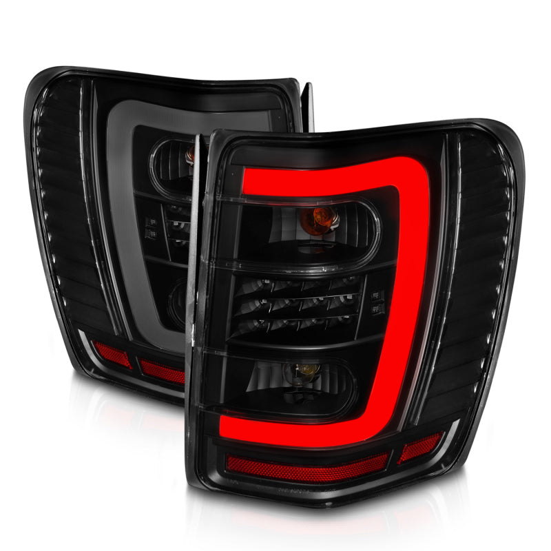 ANZO 1999-2004 Jeep Grand Cherokee LED Tail Lights w/ Light Bar Black Housing Smoke Lens 311395 311395 Photo - Unmounted