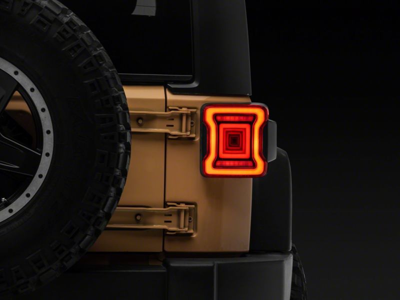 Raxiom 07-18 Jeep Wrangler JK Axial Series JL Style LED Tail Lights- BlkHousing- Red Lens J164242 J164242 Photo - Close Up