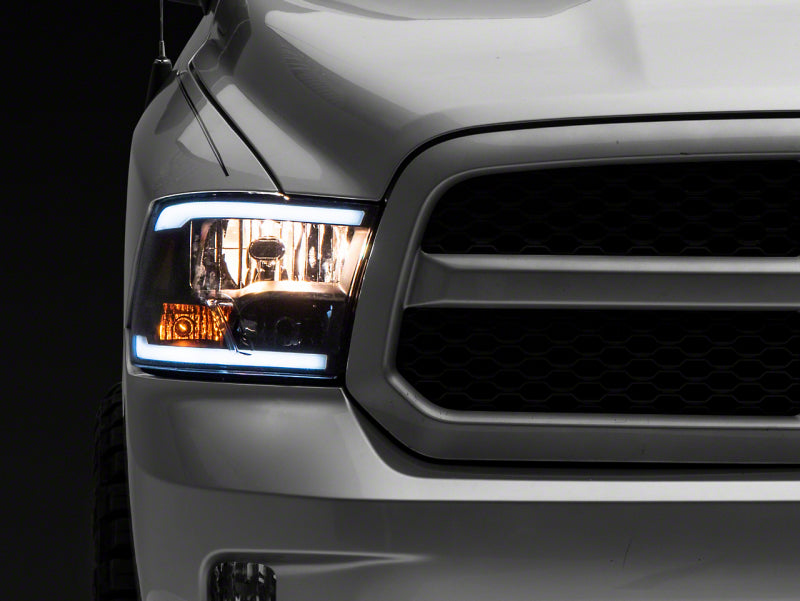 Raxiom 09-18 Dodge RAM 1500/2500/3500 Axial Series Headlights w/ LED Bar- Blk Housing (Clear Lens) R131481 R131481 Photo - Primary