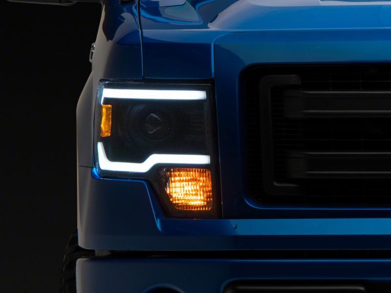 Raxiom 09-14 Ford F-150 Axial Series Projector Headlights w/ LED Light Bar- Blk Housing (Clear Lens) T566369 T566369 Photo - Close Up