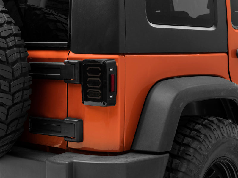 Raxiom 07-18 Jeep Wrangler JK LED Tail Lights- Black Housing (Smoked Lens) J106751 J106751 Photo - Close Up