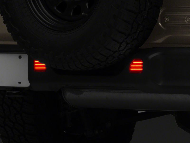 Raxiom 18-23 Jeep Wrangler JL Moab Rubicon Sahara Axial LED Rear Bumper Reflector Lights- Smoked J134141-JL J134141-JL Photo - Close Up
