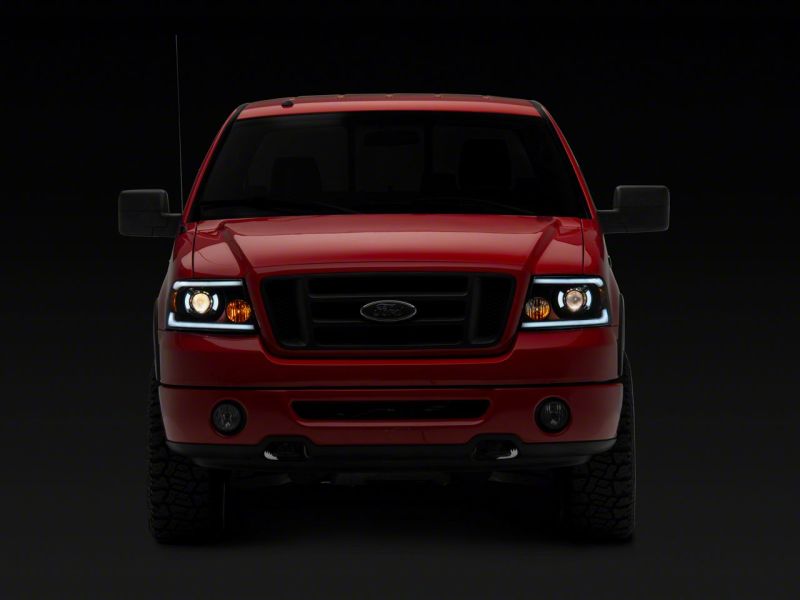Raxiom 04-08 Ford F-150 Axial Series Projector Headlights w/ SEQL LED Bar- Blk Housing (Clear Lens) T566364 T566364 Photo - Close Up
