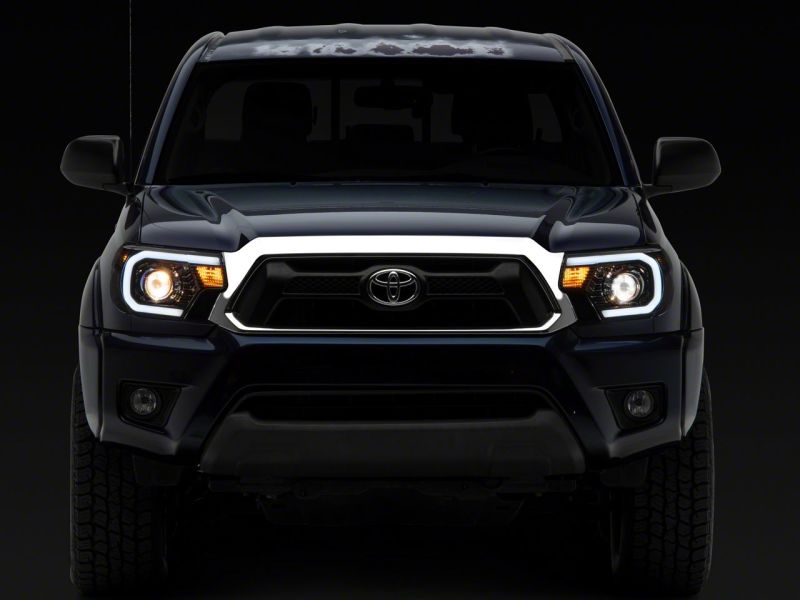 Raxiom 12-15 Toyota Tacoma Axial Series Projector Headlights w/ LED Bar- Blk Housing (Clear Lens) TT21849 TT21849 Photo - Close Up