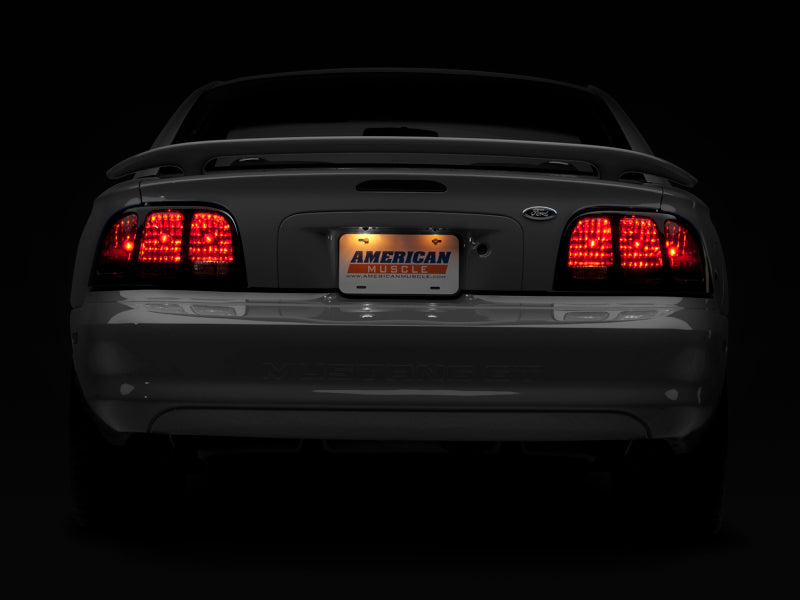Raxiom 96-98 Ford Mustang Tail Lights- Black Housing (Smoked Lens) 49124 49124 Photo - Close Up