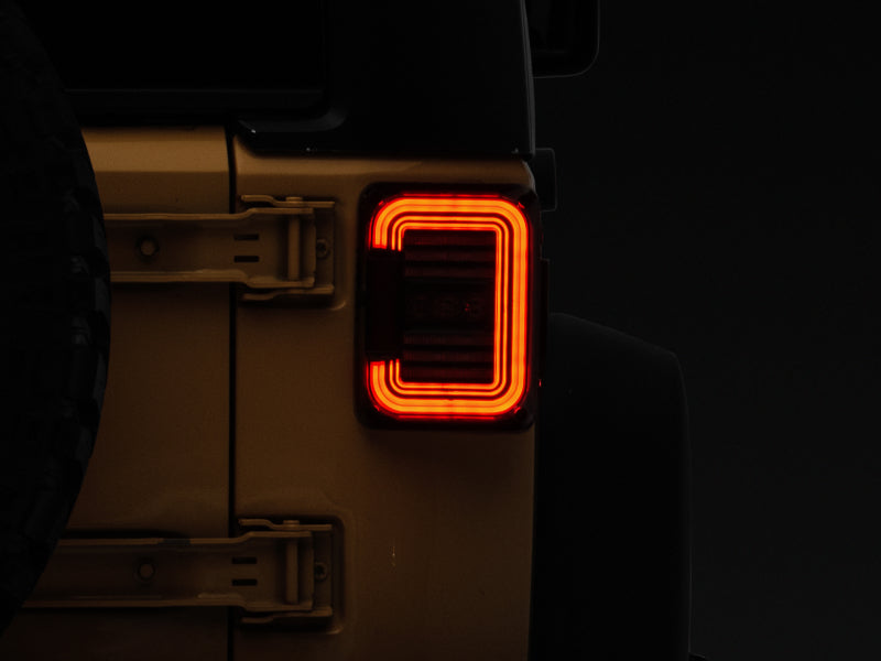 Raxiom 07-18 Jeep Wrangler JK Axial Series LED Halo Tail Lights- Black Housing (Dark Smoked Lens) J138358 J138358 Photo - Close Up