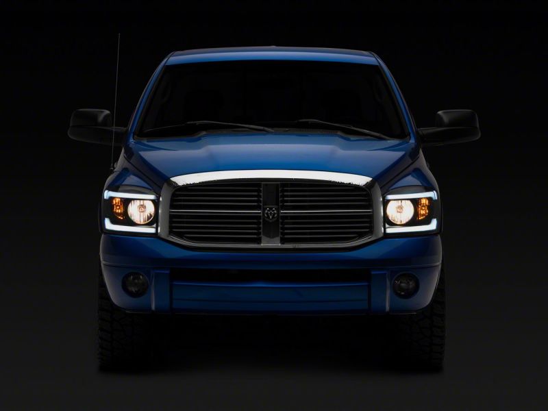 Raxiom 06-09 Dodge RAM 1500/2500/3500 Axial Headlights w/ SEQL LED Bar- Blk Housing (Clear Lens) R131480 R131480 Photo - Close Up