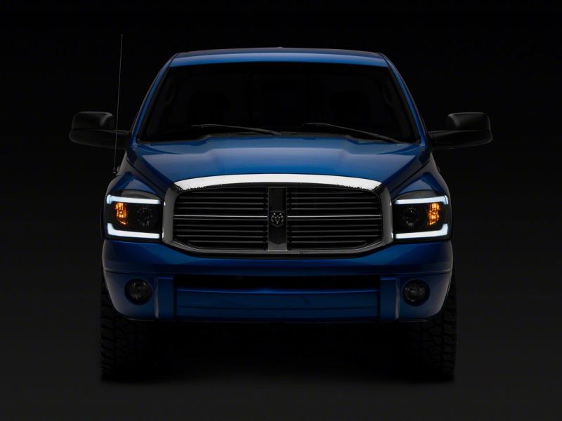 Raxiom 06-09 Dodge RAM 1500/2500/3500 Axial Headlights w/ SEQL LED Bar- Blk Housing (Clear Lens) R131480 R131480 Photo - Close Up