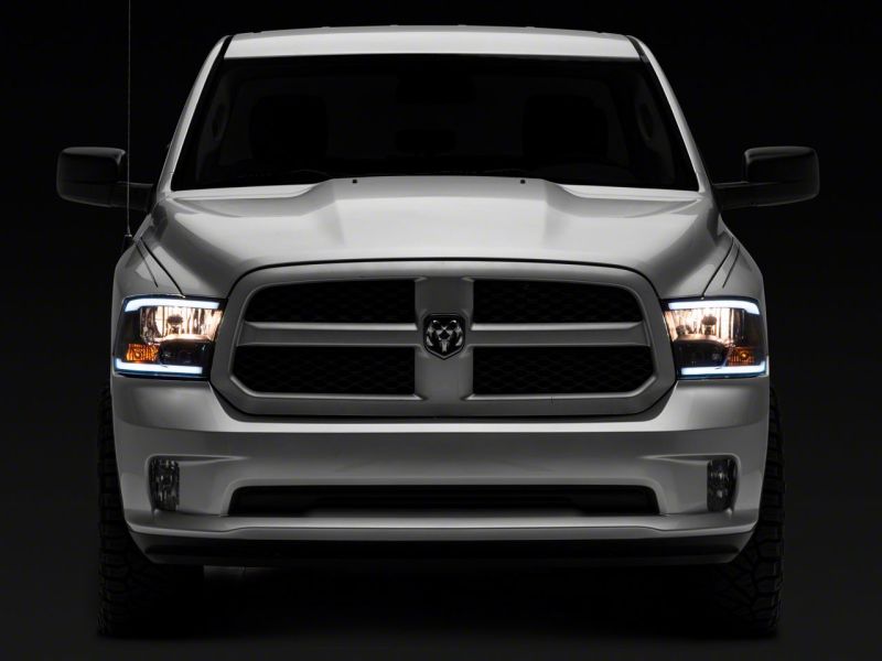 Raxiom 09-18 Dodge RAM 1500/2500/3500 Axial Series Headlights w/ LED Bar- Blk Housing (Clear Lens) R131481 R131481 Photo - Close Up