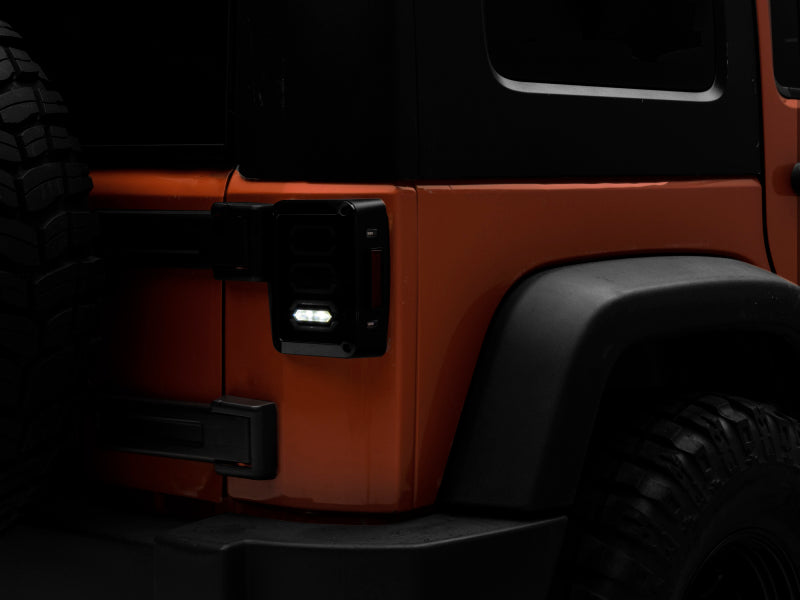 Raxiom 07-18 Jeep Wrangler JK LED Tail Lights- Black Housing (Smoked Lens) J106751 J106751 Photo - Close Up