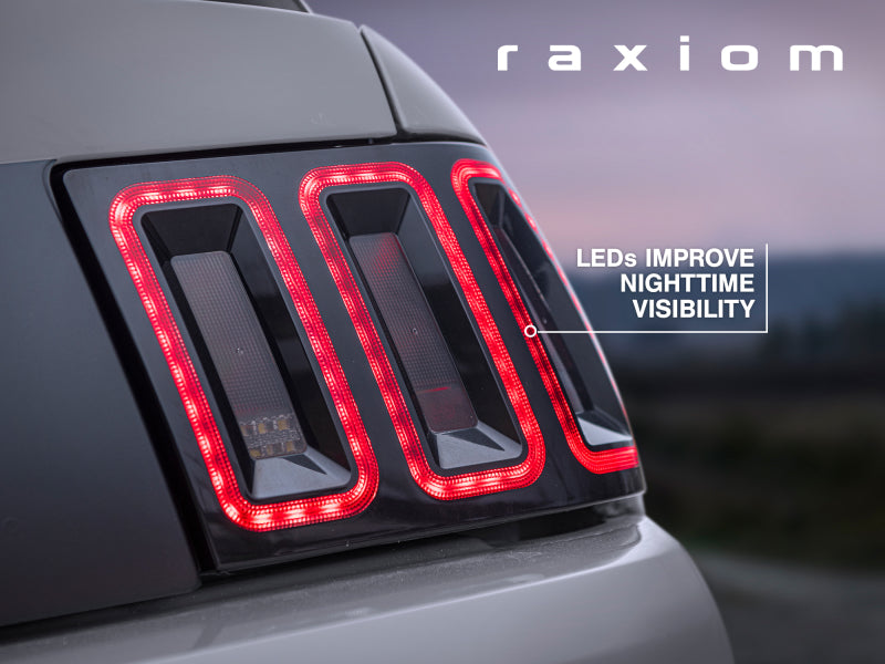 Raxiom 99-04 Ford Mustang Excluding 99-01 Cobra Icon LED Tail Lights- Black Housing (Smoked Lens) 100807 100807 Photo - Close Up