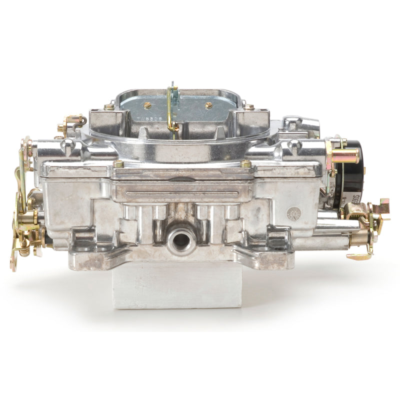 Edelbrock Reconditioned Carb #1406, 1 7/8" x 3 1/2" Steel Collector w/ 7-8" 9906 Photo - out of package