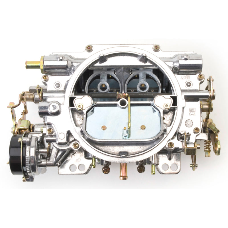 Edelbrock Reconditioned Carb #1406, 1 7/8" x 3 1/2" Steel Collector w/ 7-8" 9906 Photo - out of package