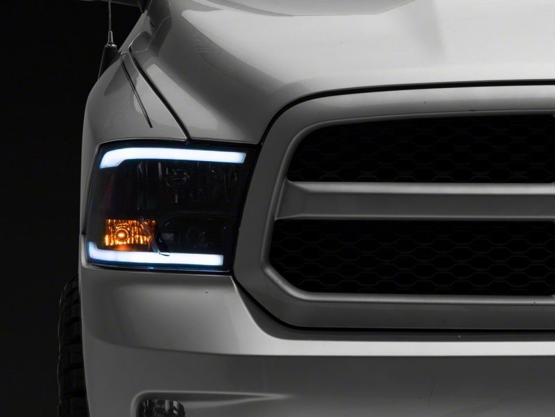 Raxiom 09-18 Dodge RAM 1500/2500/3500 Axial Headlights w/ SEQL LED Bar- Blk Housing (Clear Lens) R131482 R131482 Photo - Close Up