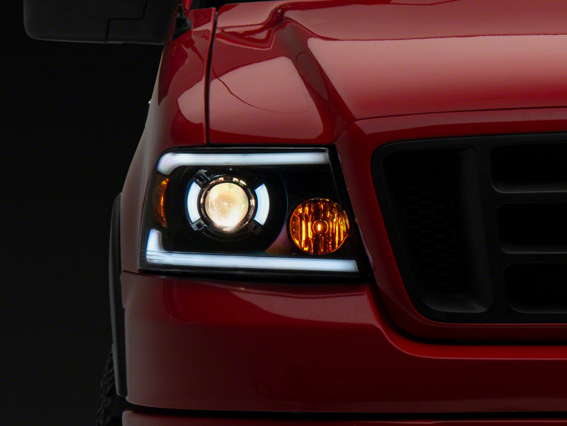 Raxiom 04-08 Ford F-150 Axial Series Projector Headlights w/ SEQL LED Bar- Blk Housing (Clear Lens) T566364 T566364 Photo - Primary