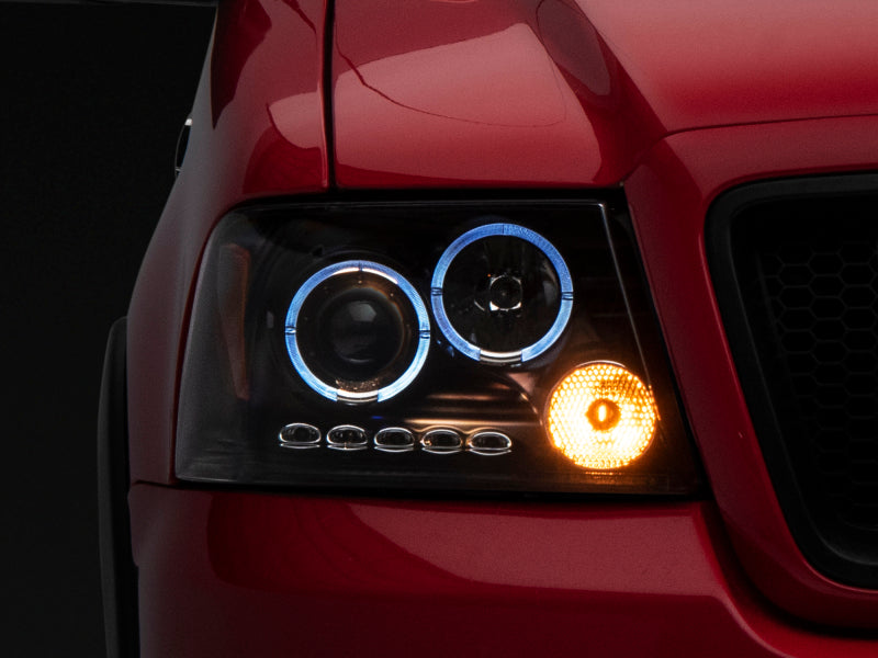Raxiom 04-08 Ford F-150 Dual LED Halo Projector Headlights- Black Housing (Clear Lens) T542827 T542827 Photo - Close Up