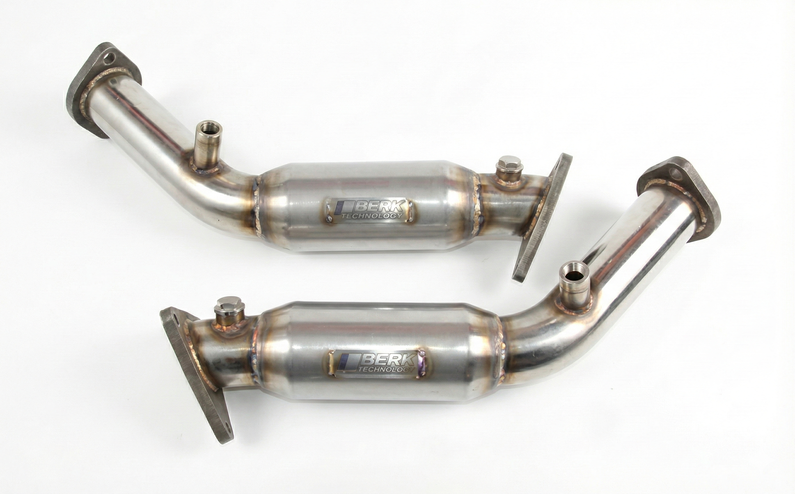 Two metallic exhaust pipes on a white background