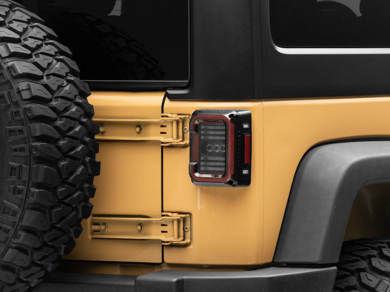 Raxiom 07-18 Jeep Wrangler JK Axial Series LED Halo Tail Lights- Black Housing (Dark Smoked Lens) J138358 J138358 Photo - Close Up