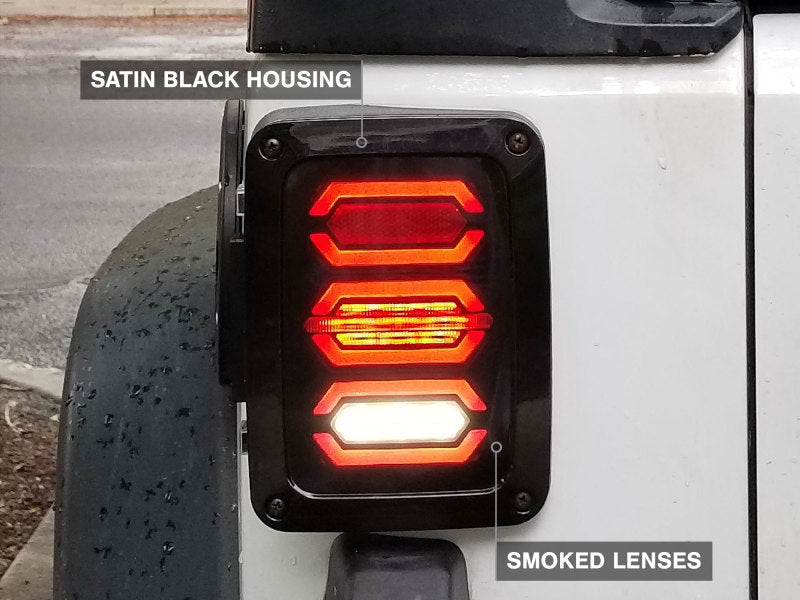 Raxiom 07-18 Jeep Wrangler JK LED Tail Lights- Black Housing (Smoked Lens) J106751 J106751 Photo - Close Up