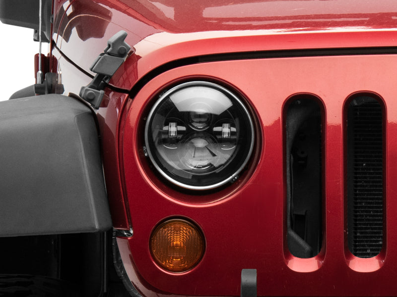 Raxiom 97-18 Jeep Wrangler TJ/JK Axial Series LED Daymaker Headlights- Black Housing (Clear Lens) J108042 J108042 Photo - Close Up