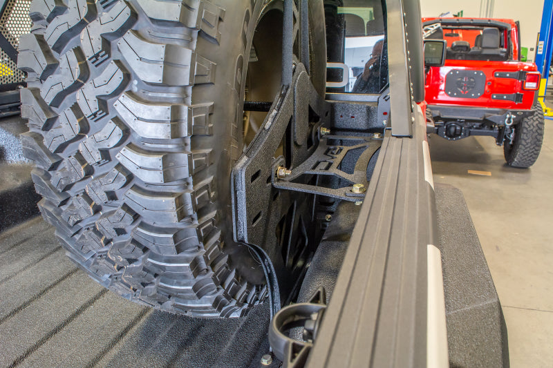 DV8 Offroad 2019+ Jeep Gladiator Universal Stand Up In-Bed Tire Carrier TCGL-02 TCGL-02 Photo - Mounted