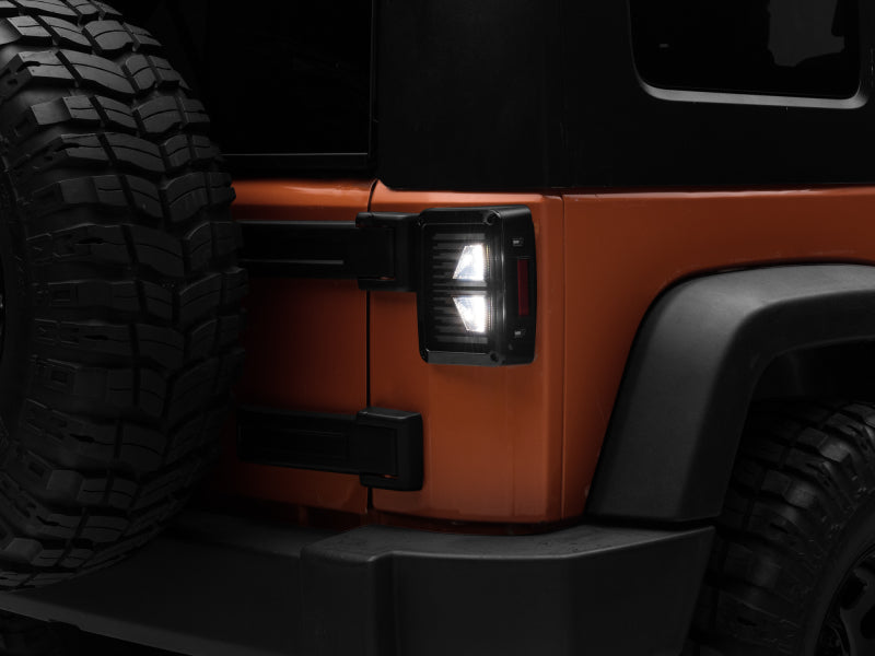 Raxiom 07-18 Jeep Wrangler JK Axial Series Vision LED Tail Lights- Black Housing (Smoked Lens) J130808 J130808 Photo - Close Up