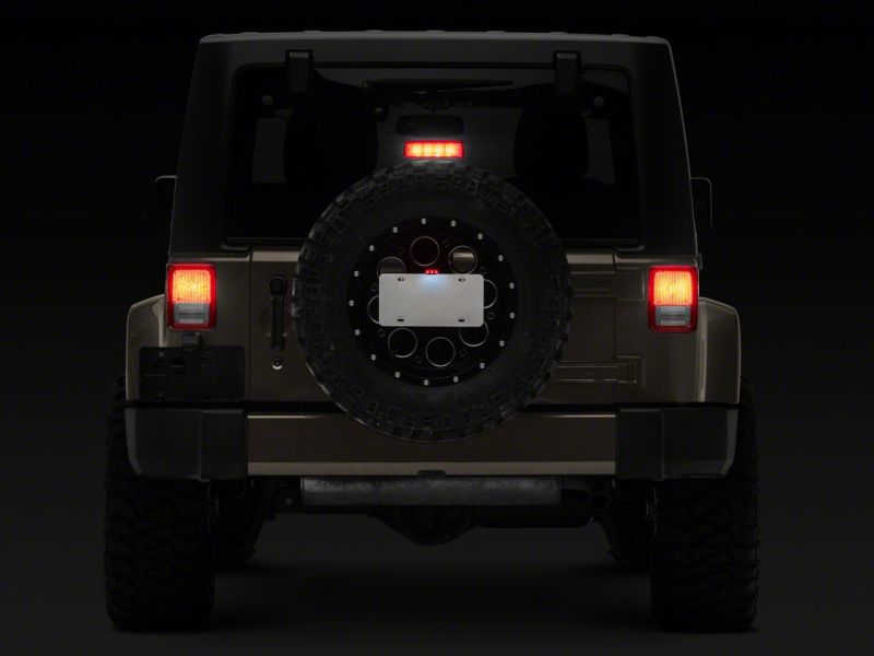 Raxiom 07-18 Jeep Wrangler JK Axial Series License Plate Bracket w/ LED Brake Light J132759 J132759 Photo - Close Up