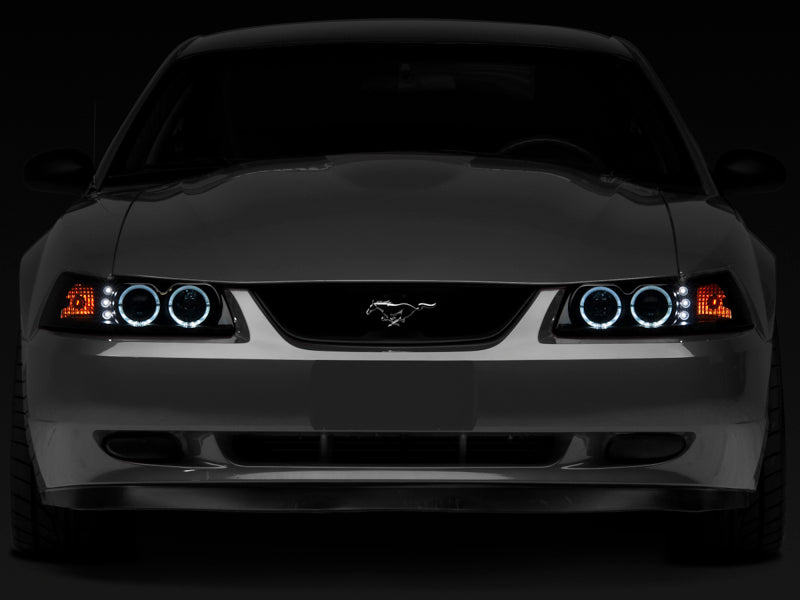 Raxiom 99-04 Ford Mustang Dual LED Halo Projector Headlights- Black Housing (Smoked Lens) 49113 49113 Photo - Close Up