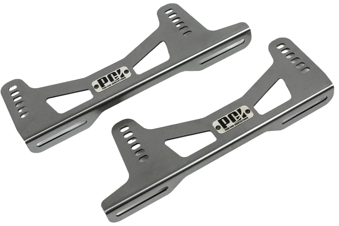 Two metallic brackets on a white background