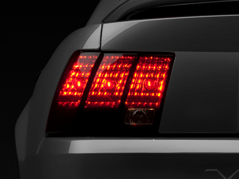 Raxiom 99-04 Ford Mustang Excluding 99-01 Cobra Tail Lights- Black Housing (Smoked Lens) 49080 49080 Photo - Primary