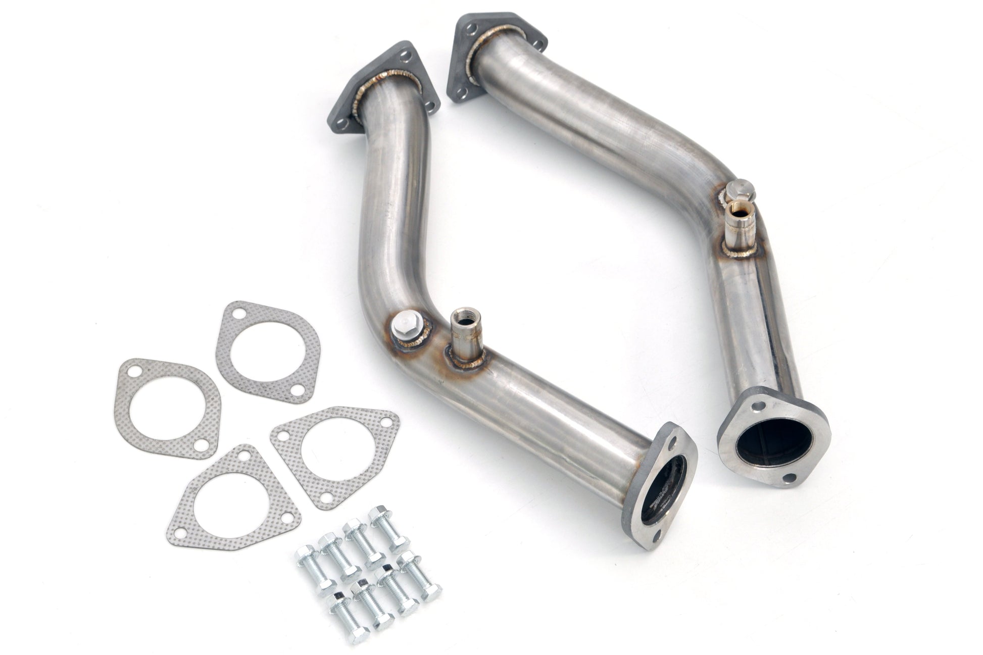 Metal exhaust pipes with gaskets and clamps on a white background
