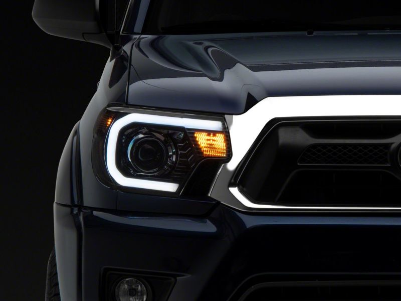 Raxiom 12-15 Toyota Tacoma Axial Series Projector Headlights w/ LED Bar- Blk Housing (Clear Lens) TT21849 TT21849 Photo - Close Up