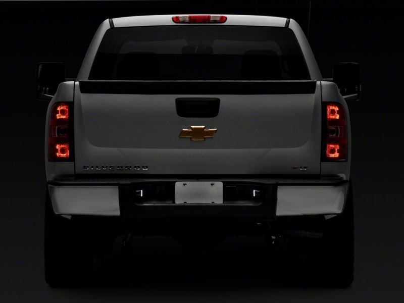 Raxiom 01-13 Chevrolet Silverado/GMC Sierra 1500 Axial Series LED License Plate Lamps- Smoked S122507 S122507 Photo - Close Up
