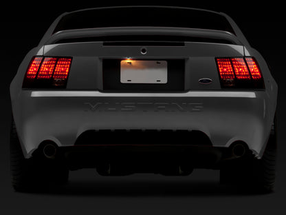 Raxiom 99-04 Ford Mustang Excluding 99-01 Cobra Tail Lights- Black Housing (Smoked Lens) 49080 49080 Photo - Close Up