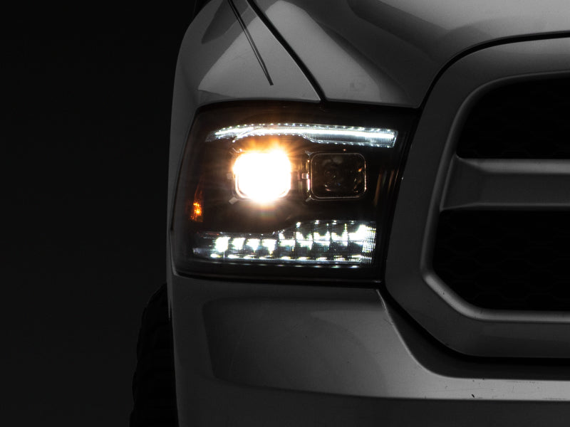 Raxiom 09-18 RAM 1500 LED Projector Headlights w/ Switchback Turn Signals- Blk Housing (Clear Lens) R111520 R111520 Photo - Primary