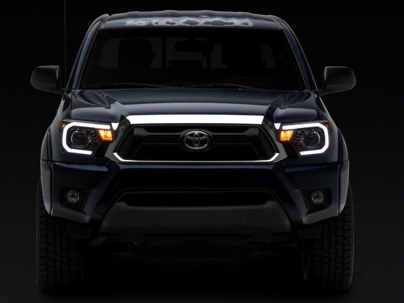 Raxiom 12-15 Toyota Tacoma Axial Projector Headlights w/ SEQL LED Bar- Blk Housing (Clear Lens) TT21850 TT21850 Photo - Close Up