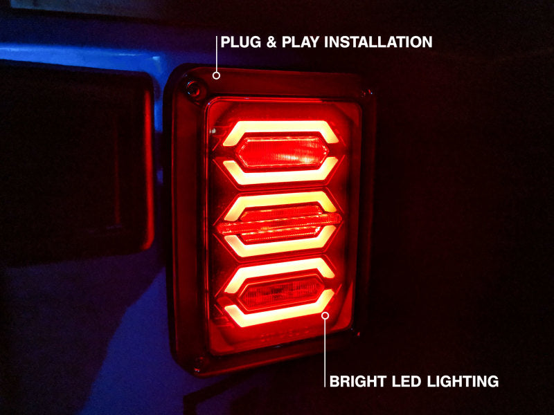 Raxiom 07-18 Jeep Wrangler JK LED Tail Lights- Black Housing (Smoked Lens) J106751 J106751 Photo - Close Up