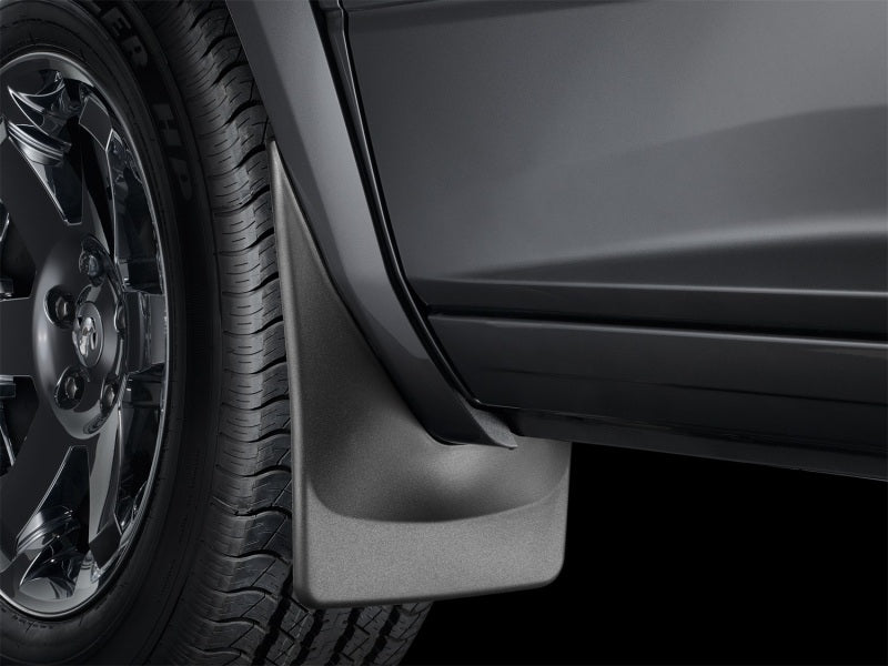 WeatherTech 99-07 Ford F-250/F-350/F-450/F-550 Front Mudflaps - Black 110001 Photo - Mounted