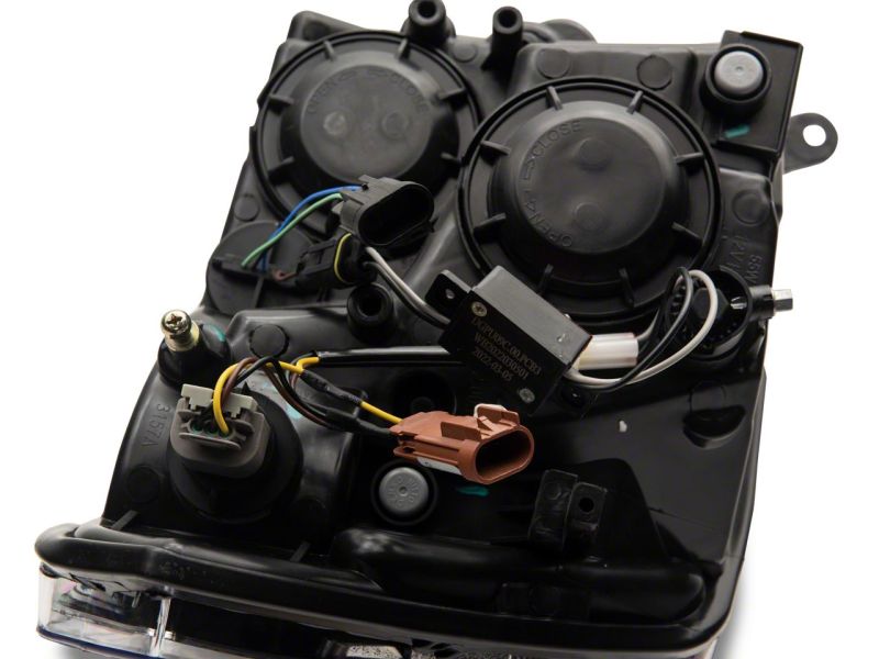 Raxiom 09-18 Dodge RAM 1500/2500/3500 Axial Series Headlights w/ LED Bar- Blk Housing (Clear Lens) R131481 R131481 Photo - Close Up