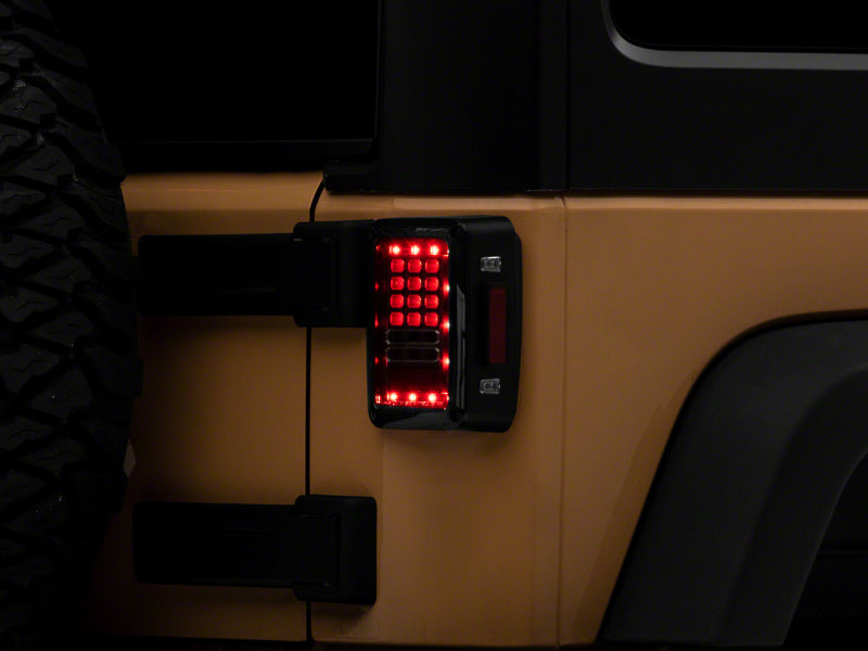 Raxiom 07-18 Jeep Wrangler JK Axial Series LED Tail Lights- Blk Housing (Clear Lens) J141585 J141585 Photo - Primary