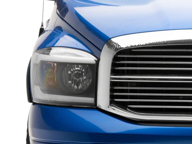 Raxiom 06-09 Dodge RAM 1500/2500/3500 Axial Headlights w/ SEQL LED Bar- Blk Housing (Clear Lens) R131480 R131480 Photo - Close Up